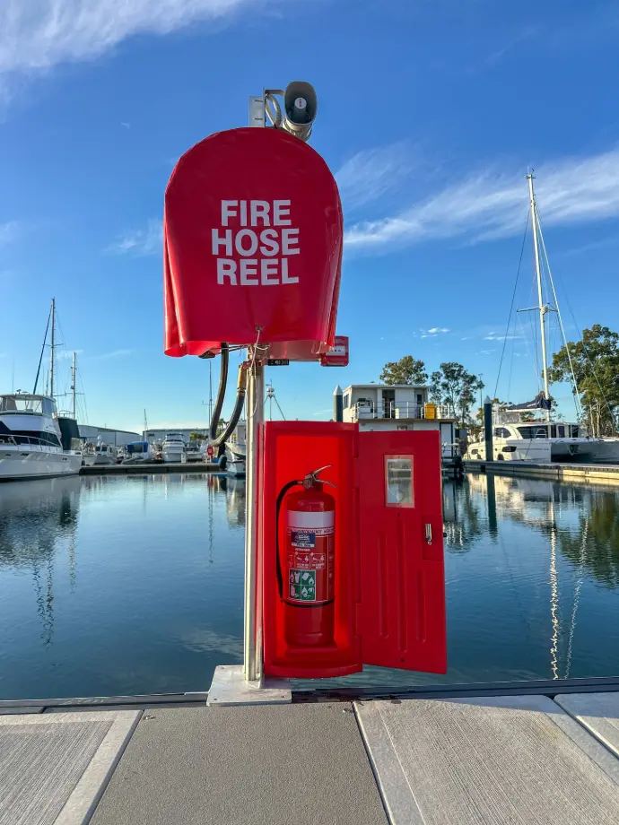M-Tech fire hose reel installed on a marina dock